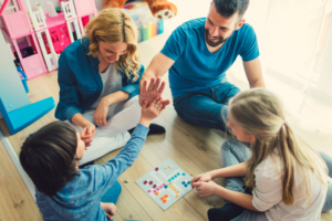 family having fun playing board game