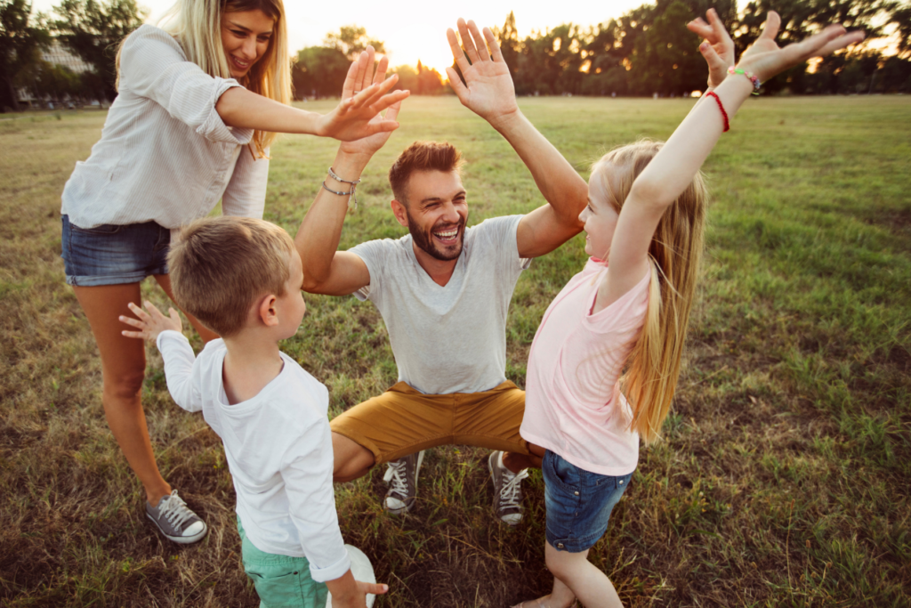 family playing together outside a solution for the problem of kids and screens